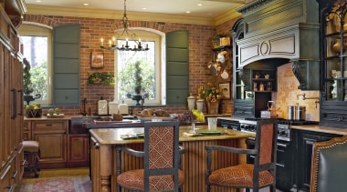 View of a traditional European-styled kitchen which features cabinetry, countertop, cuisine classique, dining room, estate, home, interior design, kitchen, living room, real estate, room, wood, brown
