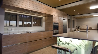 View of a kitchen which features an island interior design, kitchen, real estate, wood, brown