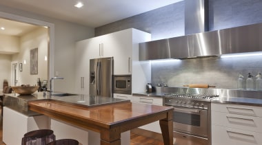View of contemporary renovated kitchen featuring timber floors, cabinetry, ceiling, countertop, cuisine classique, floor, flooring, hardwood, interior design, kitchen, laminate flooring, real estate, room, wood, wood flooring, gray, brown