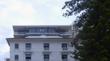 Exterior view of restored historic apartment building. apartment, architecture, building, condominium, corporate headquarters, daytime, estate, facade, home, house, mixed use, property, real estate, residential area, sky, black