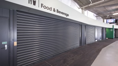 View of a metal roller door at the gray, black