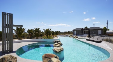 The pool has an organic feel with rocks 