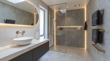 Dark woodgrain cabinetry provides contrast and ample storage, 