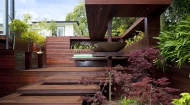 View of timber outdoor seating area with large architecture, backyard, courtyard, deck, home, house, landscaping, outdoor structure, wood, yard, red