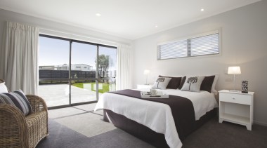 View of the master bedroom at Platinum Homes bed frame, bedroom, estate, floor, home, interior design, property, real estate, room, suite, window, gray