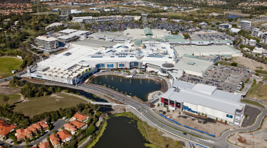 Exterior view of the Robina Town Centre where aerial photography, bird's eye view, city, metropolitan area, photography, real estate, residential area, suburb, urban area, urban design, water, waterway, gray, brown