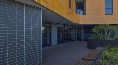 Exterior view of the Poche Centre which was apartment, architecture, building, elevation, estate, facade, home, house, property, real estate, residential area, siding, sky, window, blue