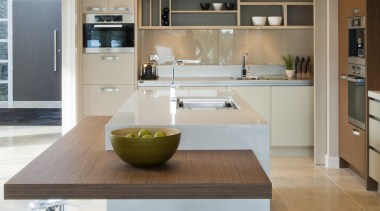 View of a kitchen designed by Suyin of countertop, cuisine classique, floor, flooring, interior design, kitchen, table, wood flooring, gray