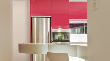 View of a kitchen which features pink coloured ceiling, floor, flooring, furniture, hardwood, interior design, kitchen, laminate flooring, living room, product design, shelf, shelving, table, wall, wood flooring, gray, orange