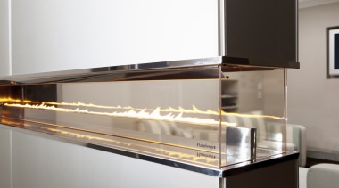 View of a contemporary all-glass, fueled fireplace by furniture, glass, product design, white