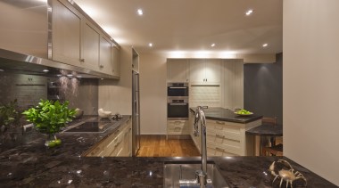 View of a kitchen which features timber floors, ceiling, countertop, flooring, interior design, kitchen, real estate, brown