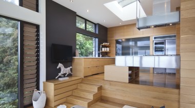 Raised floor kitchen. Stainless steel Binova cooktop. American architecture, house, interior design, living room, real estate, window, gray