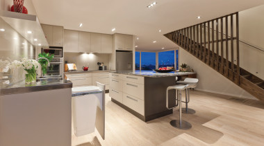 View of a large open-plan kitchen which features countertop, floor, interior design, kitchen, real estate, orange, brown