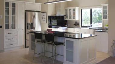 View of a kitchen designed and manufactured by cabinetry, countertop, cuisine classique, desk, floor, furniture, kitchen, room, gray