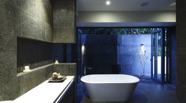 View of dark-toned bathroom with white tub. - architecture, bathroom, ceiling, daylighting, estate, interior design, room, black, gray