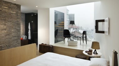 View of a contemporary boutique hotel in Shanghai. architecture, bed frame, bedroom, floor, furniture, interior design, living room, property, room, suite, wall, gray, white