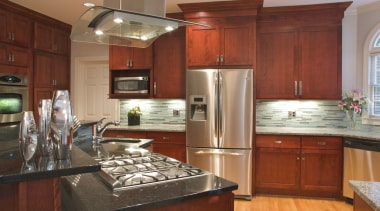 View of a wooden kitchen designed by Instinctive cabinetry, countertop, cuisine classique, hardwood, home, interior design, kitchen, real estate, room, brown, red
