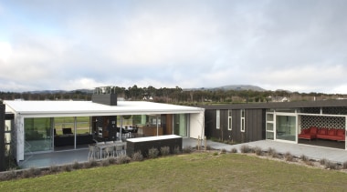 View of light and dark-toned house with zinc architecture, cottage, home, house, landscape, property, real estate, sky, white