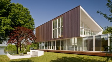 View of contemporary home. - View of contemporary architecture, corporate headquarters, cottage, elevation, estate, facade, farmhouse, home, house, mixed use, property, real estate, residential area, siding, villa, brown