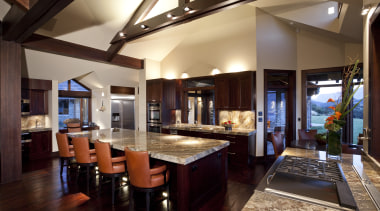 View of contemporary kitchen with dark wooden flooring, countertop, dining room, interior design, kitchen, real estate, black