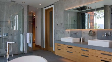 This master suite makes use of the sea bathroom, cabinetry, countertop, home, interior design, room, gray