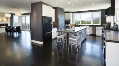 Euro style cabinetry doors. Dark quartzite counter tops. countertop, floor, flooring, hardwood, interior design, kitchen, real estate, room, wood flooring, white, black