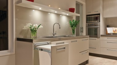 A kitchen featuring Kitchen King's Hideaway Bins. - cabinetry, countertop, cuisine classique, floor, flooring, hardwood, home appliance, interior design, kitchen, laminate flooring, room, wood flooring, orange, brown