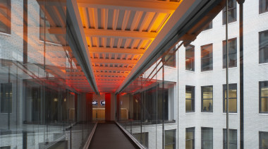 A bridge connects two sides of the offices architecture, building, daylighting, facade, black