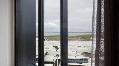 View from suite at the Novotel Auckland Airport door, glass, interior design, window, black, gray