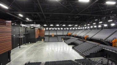 The Claudelands arena was redesigned by Chow of arena, auditorium, performing arts center, sport venue, stadium, structure, black, gray