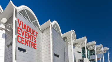 View of the Viaduct Events Center in Auckland's architecture, building, commercial building, corporate headquarters, daytime, facade, landmark, metropolitan area, mixed use, real estate, sky, structure, blue, gray