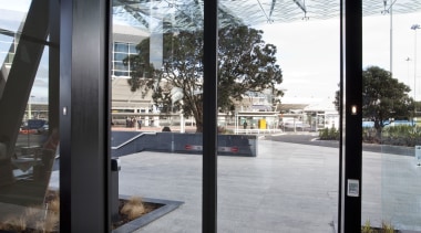 View of the entrance of Viaduct Events Center. architecture, building, door, glass, structure, window, gray, black