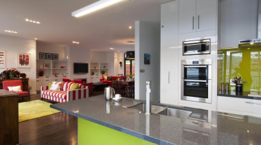 This house was designed by Gina Jones of countertop, interior design, kitchen, real estate, room, gray