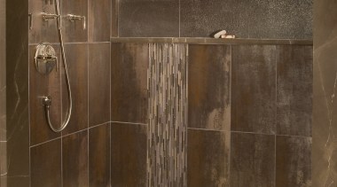 View of bathroom with brown wall tiles and bathroom, floor, flooring, plumbing fixture, shower, tile, wood, brown
