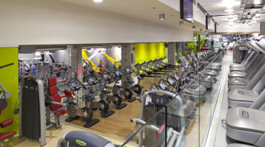 Here is a view of the Les Mills gym, room, sport venue, structure, gray