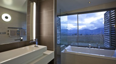 This home was designed by architect Nick Karlovsky. architecture, bathroom, condominium, estate, interior design, property, real estate, room, window, gray