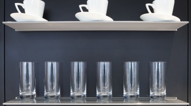 Seen here is a drinking-water system designed by bathroom, bathroom accessory, bathroom cabinet, furniture, interior design, plumbing fixture, product design, shelf, shelving, sink, tap, wall, black, white