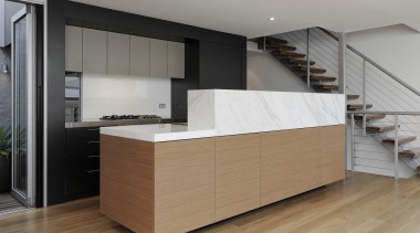 View of contemporary kitchen island with wooden flooring cabinetry, countertop, cuisine classique, floor, flooring, furniture, hardwood, interior design, kitchen, product design, room, wood, wood flooring, gray