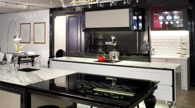 View of contemporary kitchen with lighting feature, black countertop, furniture, interior design, kitchen, table, gray