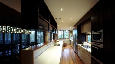 View of kitchen with wooden flooring, dark toned apartment, architecture, ceiling, daylighting, house, interior design, lighting, real estate, black, brown