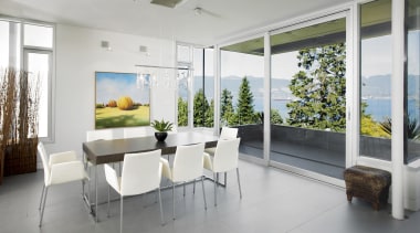 View of contemporary dining area with grey flooring, architecture, floor, house, interior design, living room, property, real estate, window, gray, white