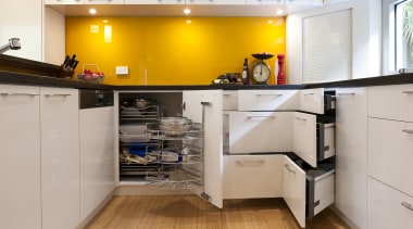 View of contemporary kitchen with yellow splashback and cabinetry, countertop, cuisine classique, floor, interior design, kitchen, room, gray