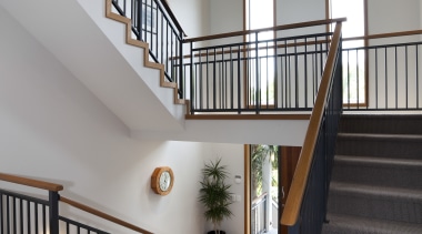 This home was designed and built by Signature architecture, balcony, baluster, daylighting, estate, floor, handrail, home, house, interior design, property, real estate, stairs, window, wood, gray