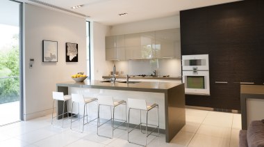 View of contemporary kitchen with light toned flooring, countertop, floor, interior design, kitchen, real estate, room, gray