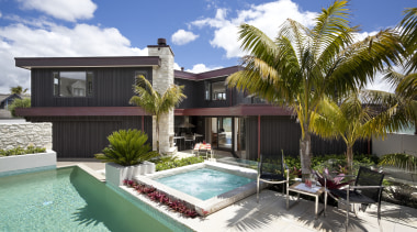 View of pool and patio area of contemporary cottage, elevation, estate, facade, home, house, palm tree, property, real estate, resort, swimming pool, villa