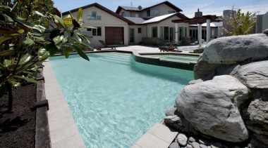 View of contemporary house with pool. - View estate, leisure, property, real estate, resort, swimming pool, water, black, gray, teal