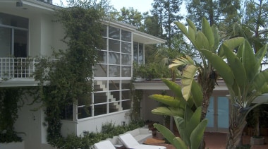 The original 1950s house on this site influenced apartment, arecales, condominium, estate, home, house, palm tree, plant, property, real estate, resort, tree, villa, window, black