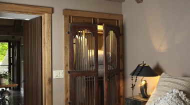 Bedroom with white bedding and exposed ceiling beams. architecture, beam, bed frame, bedroom, ceiling, home, house, interior design, room, window, wood, brown, gray