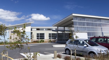 View of bridge over garden to parking lot. architecture, building, home, house, property, real estate, residential area, sky, blue, gray