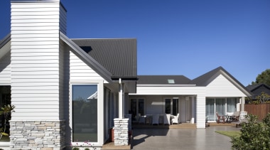 View of exterior with light toned cladding and elevation, facade, home, house, property, real estate, residential area, roof, siding, blue